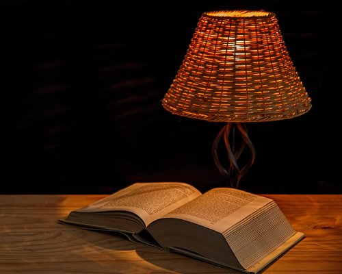 Cozy reading corner with warm ambient lamp light in the evening